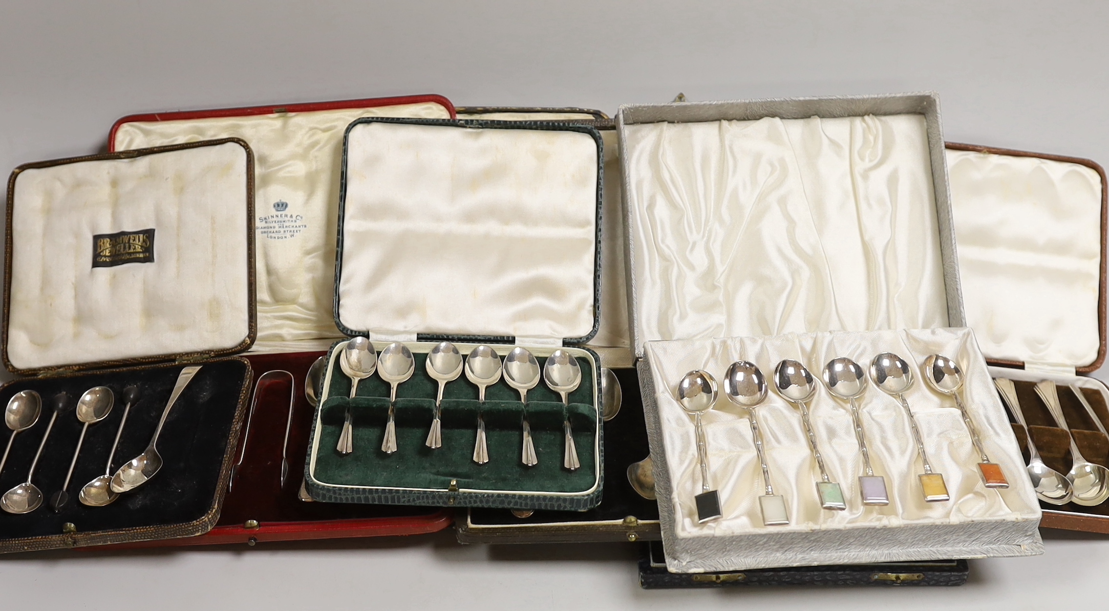 Seven various cased part sets of silver cutlery to include teaspoons etc., together with a cased set of six sterling silver faux bamboo coffee spoons with semi-precious stone tablet inset terminals.